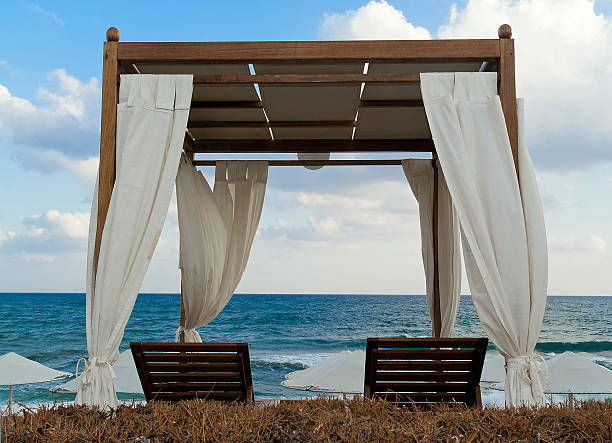 Pavilion for relax on the beach in resort. Early morning.