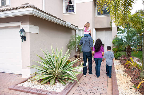 istock Multi ethnic family walking to front door 177248555