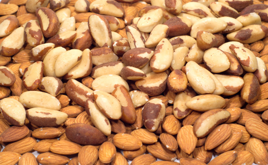 Many Almonds and Brazil nuts as a background