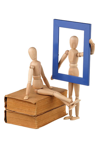 istock Two dummy, old books and photo frame 177248737