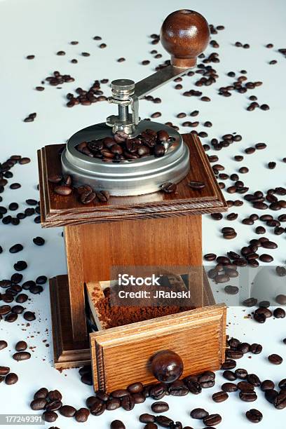 Manual Coffee Grinder With Beans On White Table Stock Photo - Download Image Now - Breakfast, Brown, Cafe