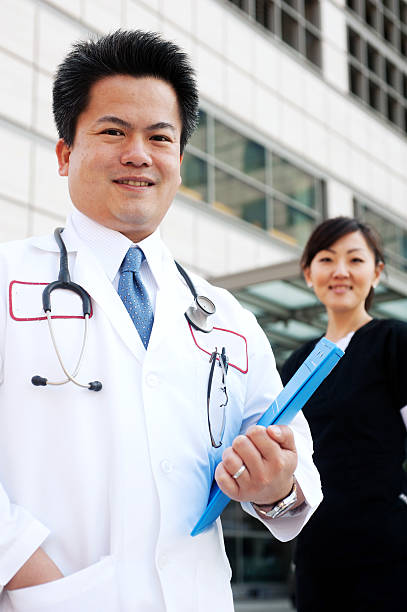 istock Asian doctor with nurse in background 177249847