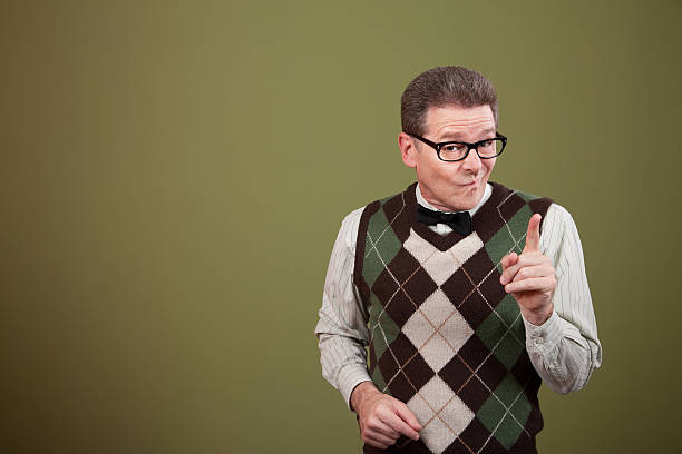 Nerd Points Index Finger Nerd pointing index finger over green background retro salesman stock pictures, royalty-free photos & images