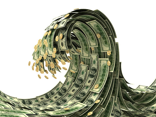 Wave representation with dollar bills and coins stock photo