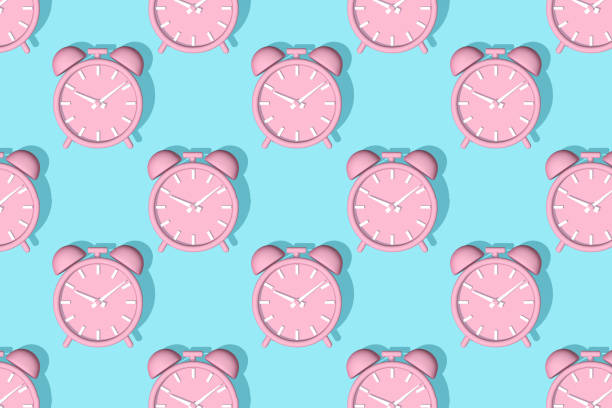 istock Pink alarm clock with shadow on blue background. Set. Seamless texture pattern. 3D illustration. 1772509217