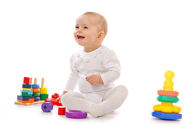 istock Small child play with toys on white background 177251095