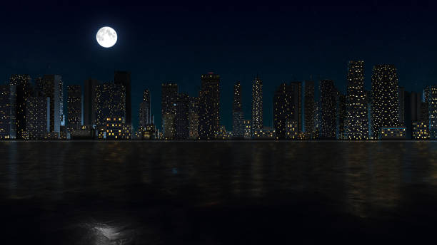 Embrace the serenity of a moonlit cityscape in this captivating image. The moon hangs over the city, casting a mesmerizing reflection on the tranquil waters below. The night comes alive as the city's lights twinkle in the darkness, creating a picturesque urban landscape. This image beautifully captures the enchanting essence of an evening under the moon's gentle glow, making it an ideal choice for projects seeking to evoke a sense of calm and urban charm.