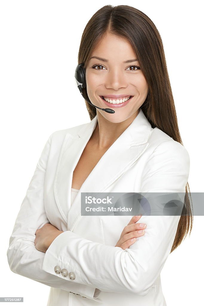 Telemarketing headset woman Telemarketing headset xwoman from call center smiling happy talking in hands free headset device. Multicultural mixed race Chinese Asian / Caucasian business xwoman in suit isolated on white background. Click for more: White Background Stock Photo