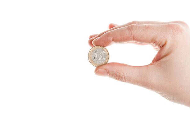 istock Female hand holding an euro coin 177251803