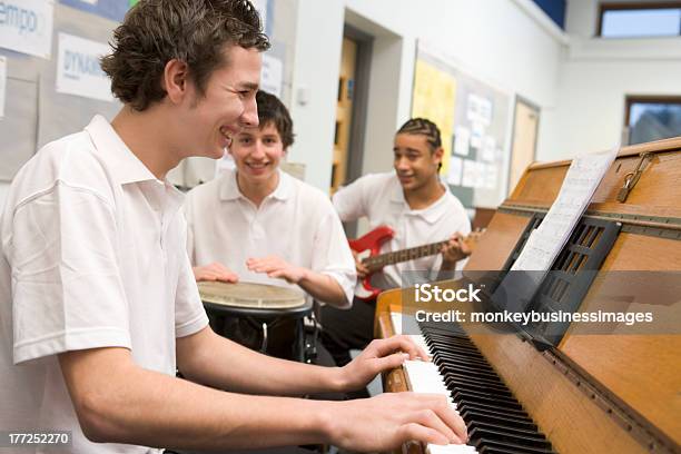 Schoolboys Playing Musical Instruments In Music Class Stock Photo - Download Image Now