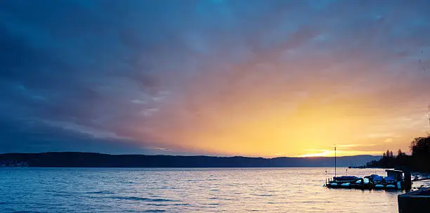 Sunset at lake of constance, boats on the right