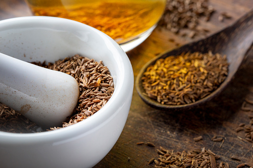 Caraway seeds, mortar and tea - alternative medicine