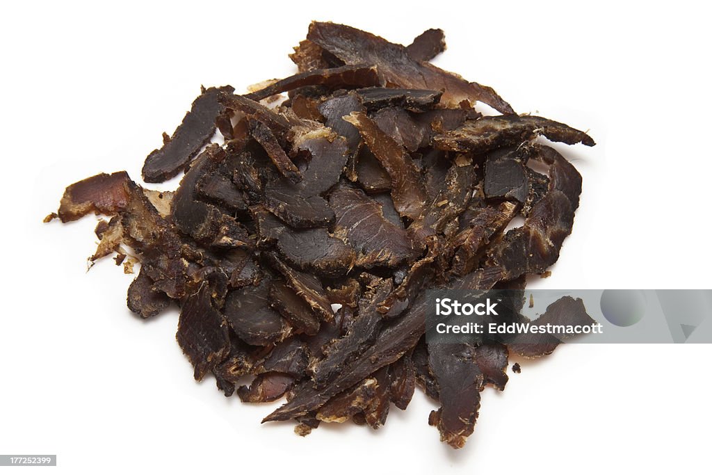 Sliced biltong Sliced biltong (dried beef) isolated on a white studio background. Beef Stock Photo