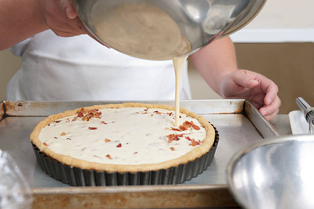 Close up of baker preparing bacon pie stock photo