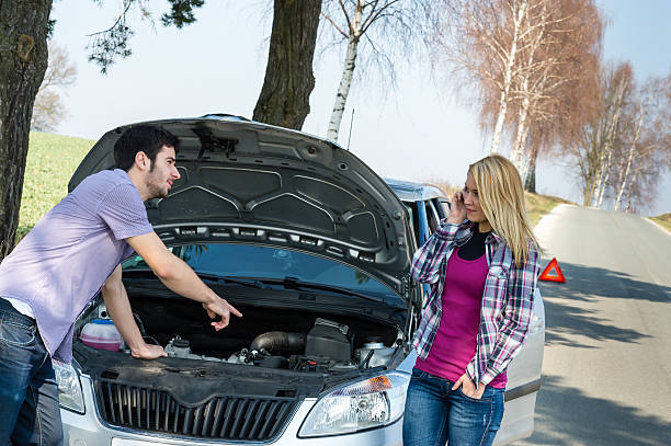 istock Car breakdown couple calling for road assistance 177253032