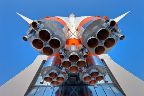 Details of space rocket engine over blue sky background