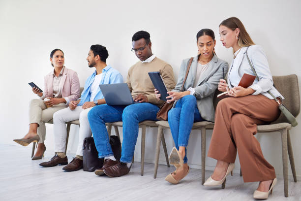 istock Creative people, technology and waiting room at office in row, networking or sitting for recruiting at office. Group of employees or team startup in line for hiring, teamwork or meeting at workplace 1772535999