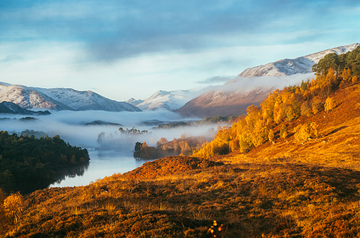 Looking south west along Loch Affric in the Highlands of Scotland. The distant hills have coated with the first snows of the autumn.