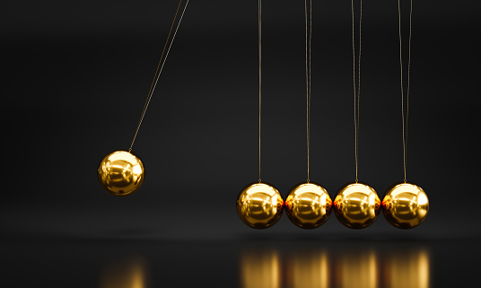 3d render of newton pendulum in gold metal background