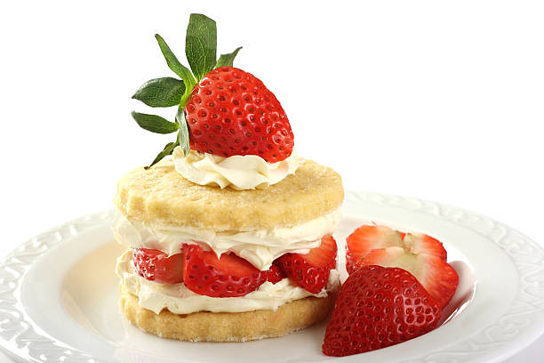 Shortcake stacked with strawberries and whipped cream stock photo