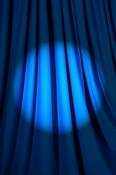istock Brightly lit curtains in theatre concept 177254364