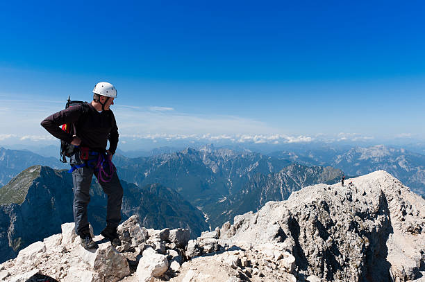istock Mountaineer is observing the valley 177254788