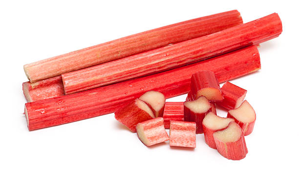 cut rhubarb sticks cut rhubarb sticks isolated on white background rhubarb photos stock pictures, royalty-free photos & images