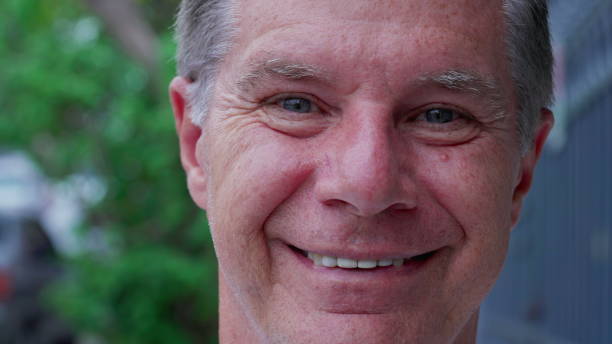 istock Happy middle-aged man macro close-up face looking at camera smiling 1772559826