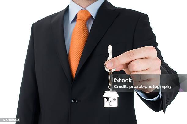 Man In Black Suit Holding A Key Stock Photo - Download Image Now - Adult, Adults Only, Apartment