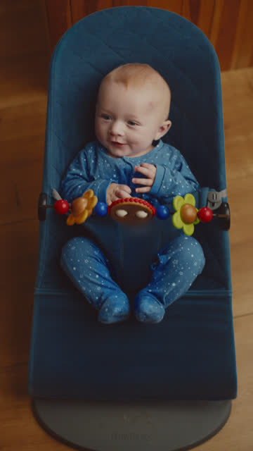 SLO MO Playful Cute Baby Boy Enjoying In Bouncer At Home