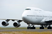 White Boeing 747 jumbo jet on the runway