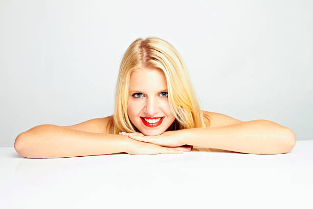 portrait of a beautiful young woman on white ground stock photo