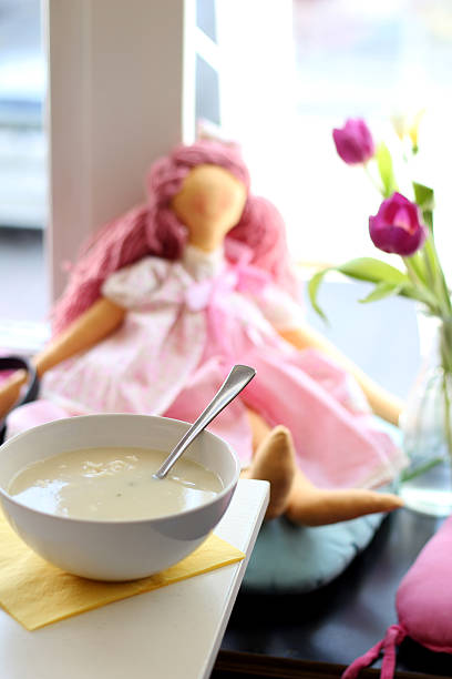 Soup in a restaurant with pink rag doll stock photo