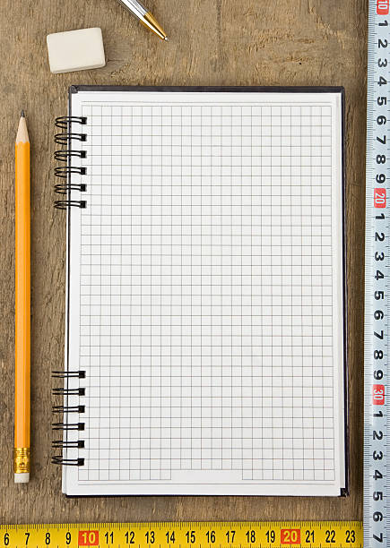 istock notebook and tape measure on wood 177257923