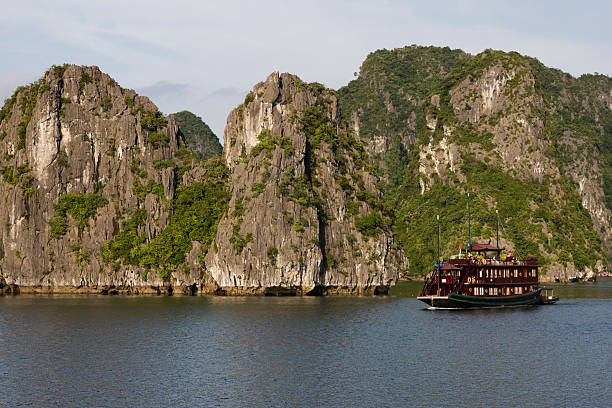 istock wooden ship in ha-long bay, vietnam 177258321
