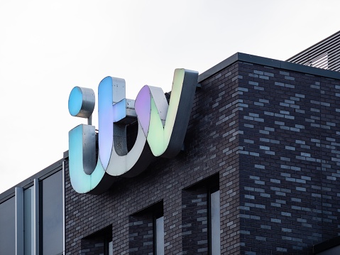 Salford, United Kingdom – October 21, 2023: The ITV sign on the outside of the television station building in Manchester, UK