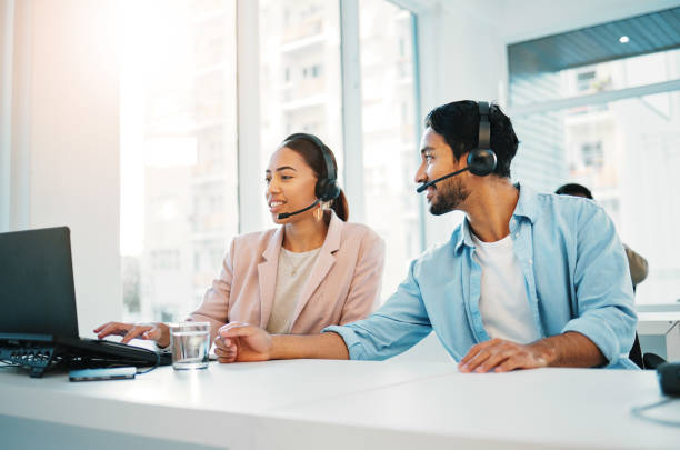 istock Call center, training with manager and support, laptop and help with CRM process, customer service and telecom. Working together, team and coaching with people in office, telemarketing and advice 1772589459