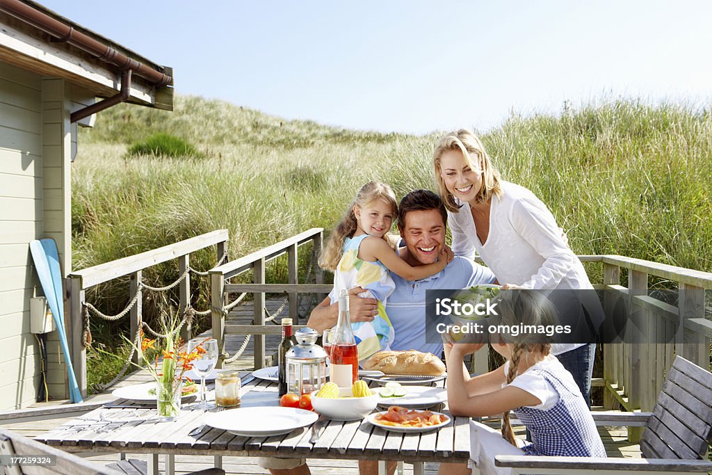 Family on vacation eating outdoors Family on vacation eating outdoors near the beach Family Stock Photo