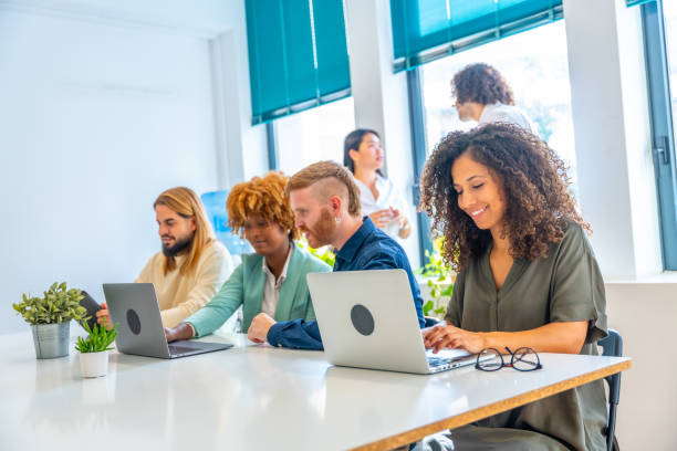 istock Man and woman sitting in a coworking using laptop 1772600849