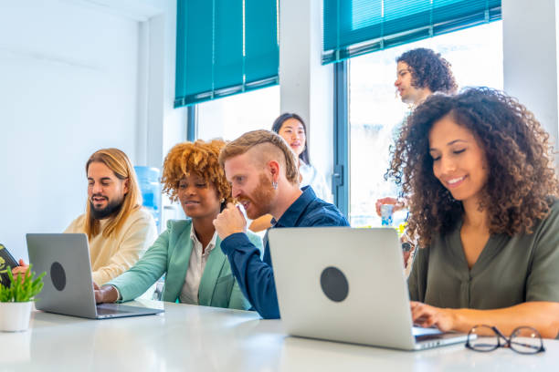 istock Young team of coworkers using laptop in a modern office 1772600854