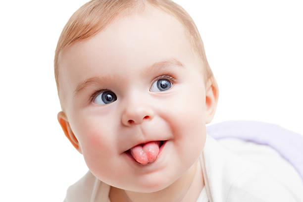 Portrait of cute blue-eyed baby Portrait of funny baby on white background human tongue stock pictures, royalty-free photos & images