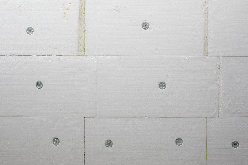Polystyrene facade insulation sheets on house wall close up