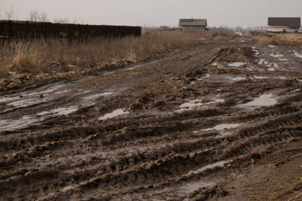 istock Dirt road after rain with deep tire tracks 1772605425