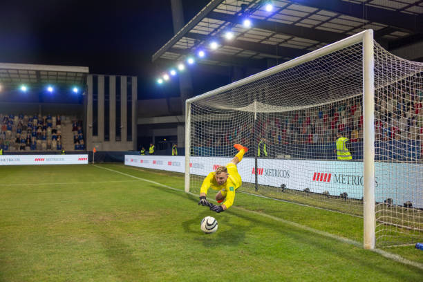 istock Male goalkeeper catching ball 1772608181