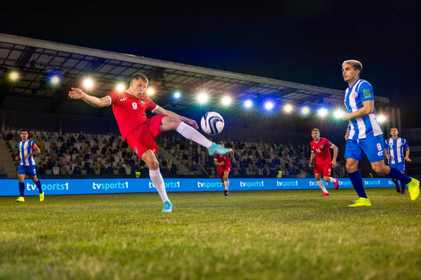 istock Male soccer player kicking ball 1772608183