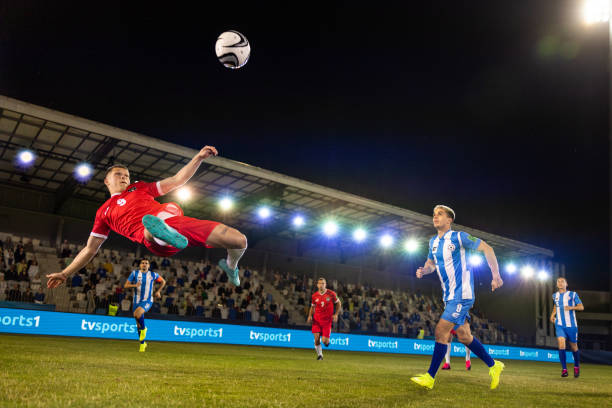 istock Male soccer player kicking ball 1772608193