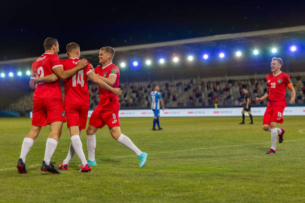 istock Soccer team hugging after scoring a goal 1772608197