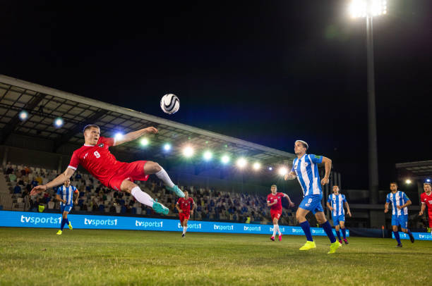istock Male soccer player kicking ball 1772608203