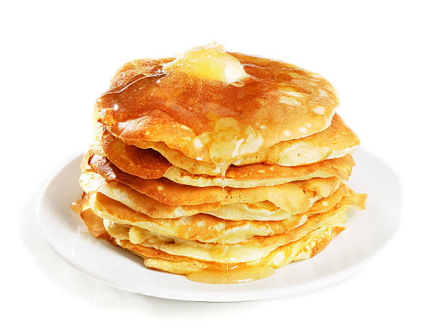 istock pancakes topped with honey 177260926
