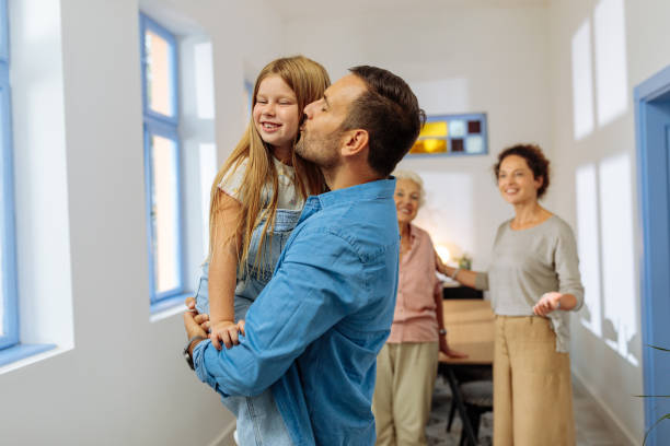 istock Father holding and kissing his daughter 1772617838